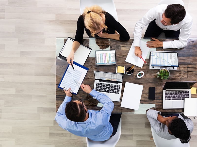 Aerial view of employees collaborating on a project
